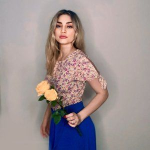 Pink shirt with a colorful flower print